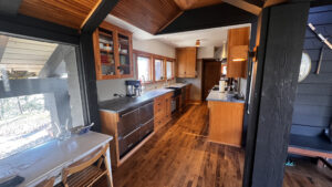 This image shows both side of the Birch wood Galley kitchen looking West. The Image was taken standing at the outdoor shelter side of the kitchen, Glen Ellyn Hilltop Gallery