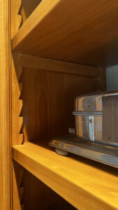 This image shows a Birch wood cabinet with wood saw-tooth shelf adjusters, and wood adjustable shelf supports. 