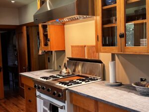 This image Shows the upper cabinets on both sides of the 48" hood. Beneath the uppers are the lower cabinets on both sides of the Viking Range. Glen Ellyn Hilltop Gallery