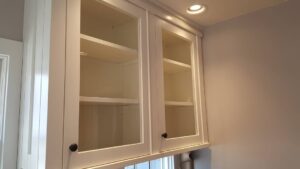 This image shows a white painted upper cabinet made of poplar wood. It has two doors.