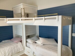 This image shows the two Bunks with four beds You can see the alarm clock cubbies at the head of the four beds. The white and blue walls are behind the beds. In this image you get a good view of the center tower in the whole assembly's Lshaped configuration. Humming Bird Exclusives.