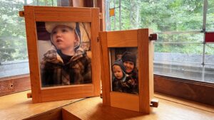 This image shows the medium, and smallest of our picture frames side by side on a table top in front of a window. You can clearly see our Mortise and tenon Stile and rail locking system on the side of the frames. Humming Bird Exclusives.